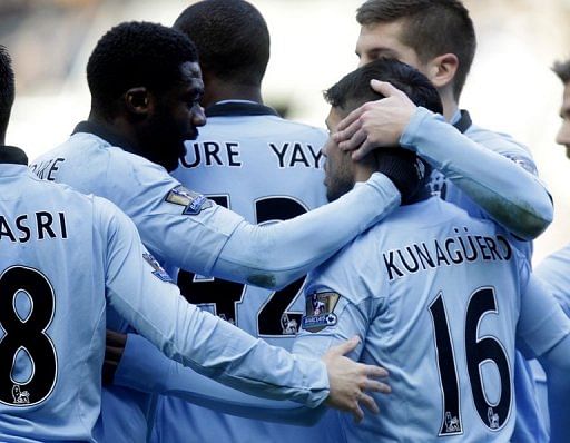 Manchester City&#039;s players celebrate scoring a goal against Newcastle, at St James Park, on December 15, 2012