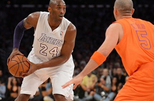 Kobe Bryant of the Los Angeles Lakers (L) is guarded by Jason Kidd of the New York Knicks on December 25, 2012