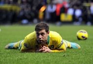 Norwich City's Grant Holt reacts after being tackled by Chelsea's David Luiz in Norwich on December 26, 2012