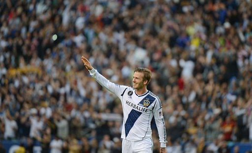 David Beckham waves to fans as he walks off the pitch on December 1, 2012 in Carson, California