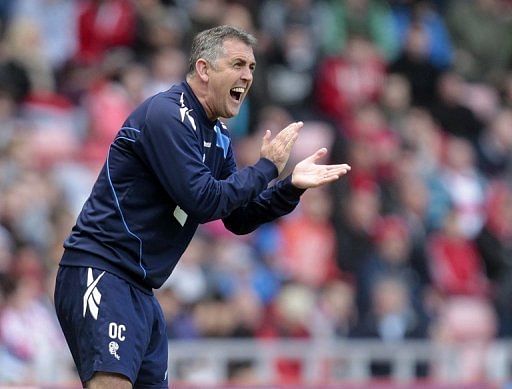 Owen Coyle shouts instructions to his Bolton players during a match against Sunderland on April 28, 2012