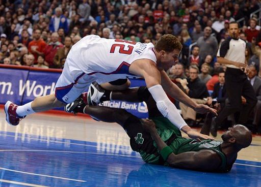 Blake Griffin of the Clippers knocks over Kevin Garnett of the  at Staples Center on December 27, 2012