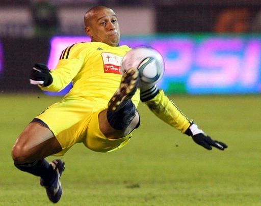 Anzhi Makhachkala&#039;s Brazilian defender Roberto Carlos clears the ball during a game in St. Petersburg on March 21, 2011