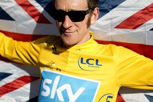 Bradley Wiggins celebrates during the 2012 Tour de France on the famous Paris-Champs-Elysees Avenue, on July 22, 2012