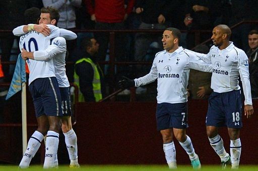 Tottenham&#039;s Emmanuel Adebayor (L) congratulates Gareth Bale on scoring a goal vs Aston Villa, on December 26, 2012