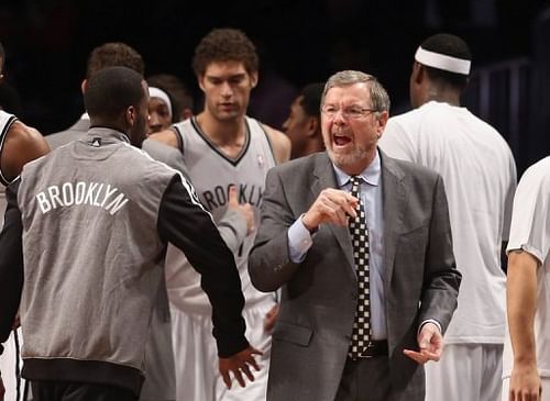 P.J. Carlesimo of the Brooklyn Nets argues with a ref at the Barclays Center on December 28, 2012