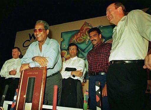 Tony Greig (R) at a cricket memorabila auction at a hotel in south Bombay, on May 16, 1997