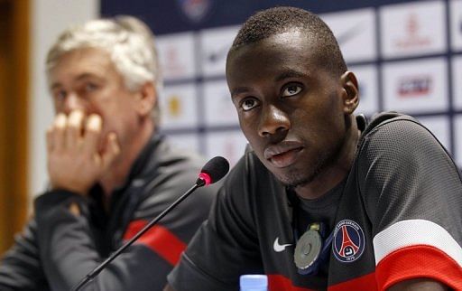 PSG midfielder Blaise Matuidi holds a joint press conference with coach Carlo Ancelotti in Doha on December 29, 2012