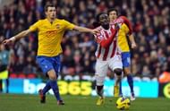 Southampton's French midfielder Morgan Schneiderlin (L) vies with Stoke City's Trinidadian striker Kenwyne Jones (R)