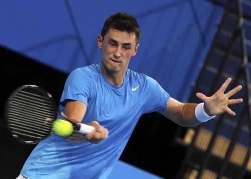 Bernard Tomich hits a return against Tommy Haas during their Hopman Cup tennis match in Perth on December 29, 2012