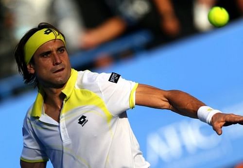 Spain's David Ferrer eyes the ball in Abu Dhabi on December 29, 2012