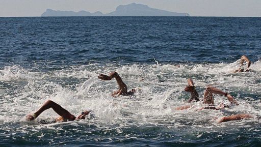File illustration photo of swimmers competing in an open water race in Italy, on August 31, 2006