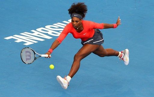 Serena Williams hits a forehand in her first-round match at the Brisbane International on December 30, 2012