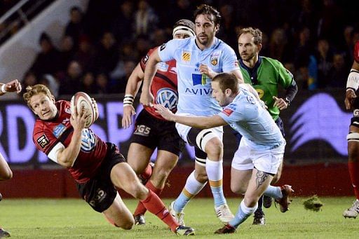 Perpignan&#039;s David Mele (R) tries to stop RC Toulon&#039;s Jonny Wilkinson (L) on December 30, 2012, at the Mayol stadium