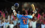 India cricketer Sachin Tendulkar raises