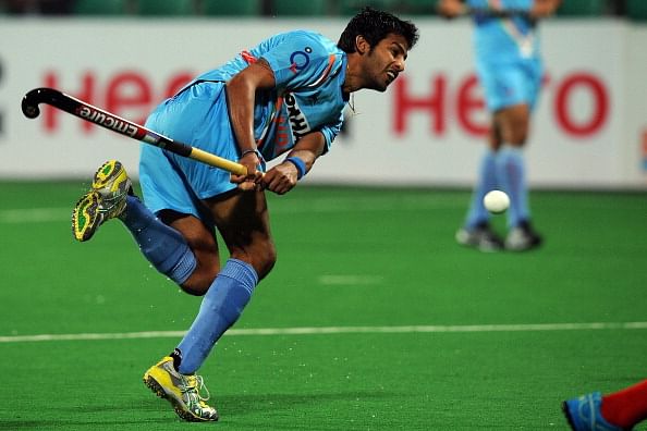 Yuvraj Walmiki of India scores a goal against Singapore during the men&#039;s field hockey match between India and Singapore of the FIH London 2012 Olympic Hockey qualifying tournament at the Major Dhyan Chand National Stadium in New Delhi on February 18, 2012.   