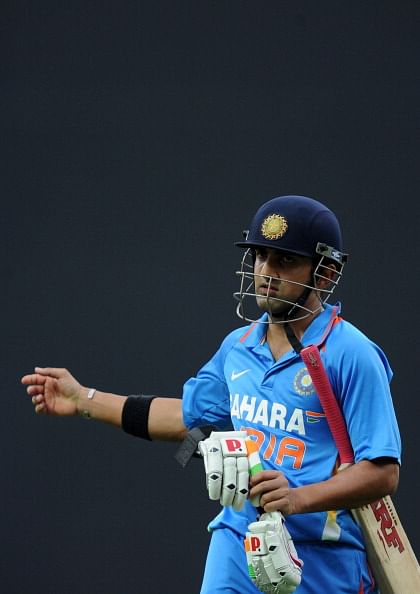 Indian cricketer Gautam Gambhir walks ba