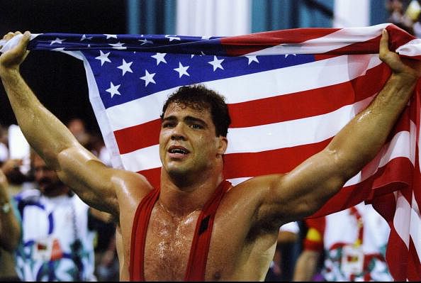 31 Jul 1996: Kurt Angle of the United States holds the American flag at the free-style wrestling competition during the Summer Olympics at the Georgia World Congress Center in Atlanta, Georgia.