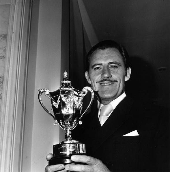 20th November 1968:  British motor-racing driver Graham Hill (1929 - 1975) with the world racing driver&#039;s championship trophy.