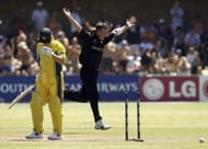 Shane Bond of New Zealand celebrates taking the wicket of Ian Harvey of Australia to finish with figures of 6 for 23