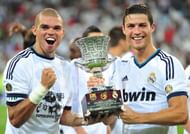 Crisitano Ronaldo with his team mate Pepe holding Supercopa DeEspana trophy