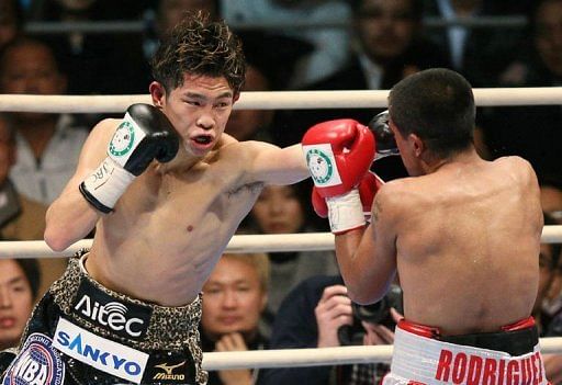 Japan&#039;s Kazuto Ioka (L) fights Jose Rodriguez of Mexico in Osaka on December 31, 2012