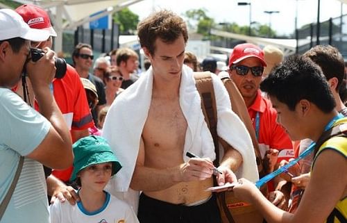 Andy Murray signs autographs after a training session in Brisbane, on January 1, 2013