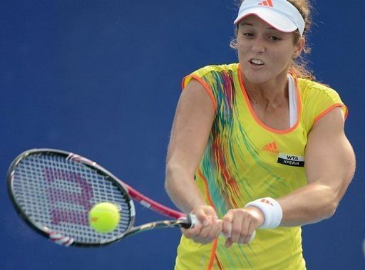 Laura Robson returns a ball during her women&#039;s singles match in Beijing on October 2, 2012