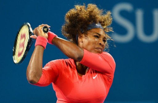 Serena Williams hits a backhand return to Alize Cornet at the Brisbane International on January 1, 2013