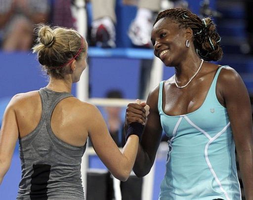 Venus Williams of the US (R) and Mathilde Johansson of France (L) after their match in Perth on January 1, 2013