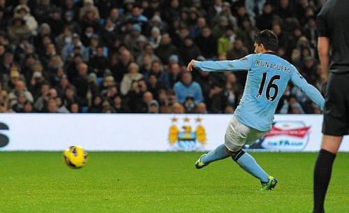 Manchester City's Sergio Aguero scores at The Etihad stadium in Manchester, on January 1, 2013 Manchester City's Sergio Aguero scores at The Etihad stadium in Manchester, on January 1, 2013