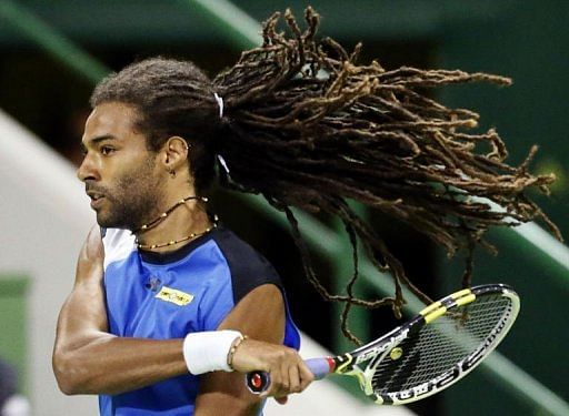 Dustin Brown returns the ball to David Ferrer during the 2013 ATP Qatar Open in Doha on January 1, 2013