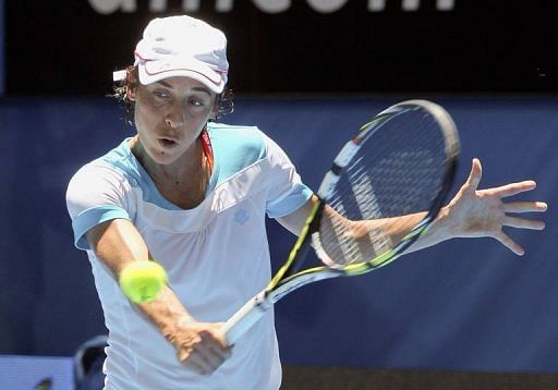 Francesca Schiavone hits a return against Tatjana Malek during their singles match at the Hopman Cup on January 2, 2013