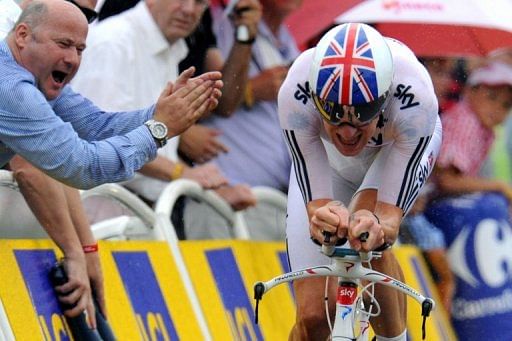 A spectator supports Britain&#039;s Bradley Wiggins competing on July 3 during the 2010 Tour de France cycling race