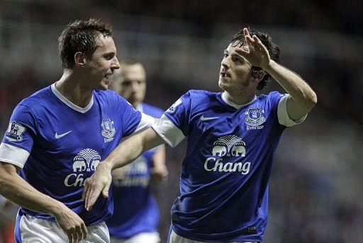 Everton&#039;s Leighton Baines (R) celebrates scoring at St James&#039; Park in Newcastle on January 2, 2013
