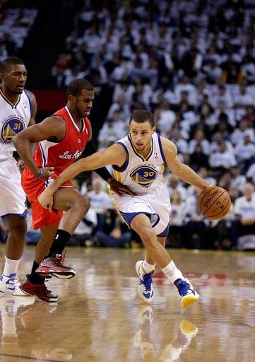 Stephen Curry of the Golden State Warriors drives on Chris Paul of the Clippers at Oracle Arena on January 2, 2013