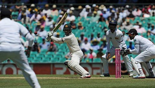 Australia&#039;s Phil Hughes (C) plays a cut shot during Test against Sri Lanka, in Sydney, on January 4, 2013.
