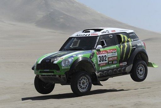 France&#039;s driver Stephane Peterhansel steers his Mini during the 2012 Dakar Rally Nasca-Pisco, Peru on January 14, 2012