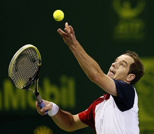 France&#039;s Richard Gasquet serves to Germany&#039;s Daniel Brands at the Qatar Open in Doha on January 4, 2013