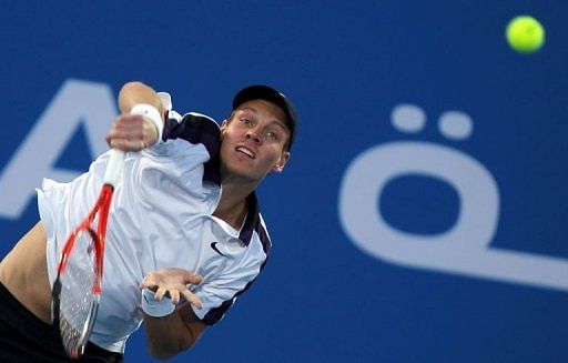 Tomas Berdych serves in Abu Dhabi on December 31, 2010