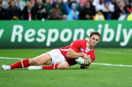 George North runs in a try during a match in Hamilton on October 2, 2011
