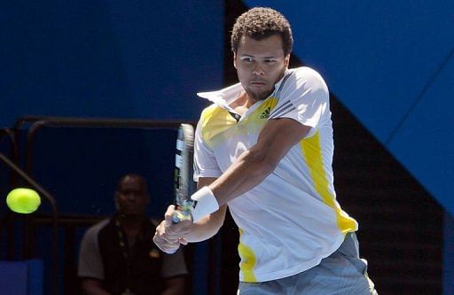 Jo-Wilfried Tsonga of France hits a return in Perth on January 4, 2012