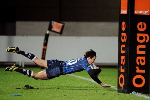 Montpellier&#039;s Francois Trinh-Duc scores a try during their match against Stade Francais, on December 30, 2012