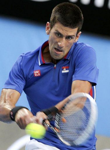 Novak Djokovic of Serbia hits a return in Perth on January 5, 2013