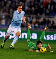 Lazio's forward Miroslav Klose (L) fights with Cagliari's goalkeeper Michael Agazzi on January 5, 2013 in Rome