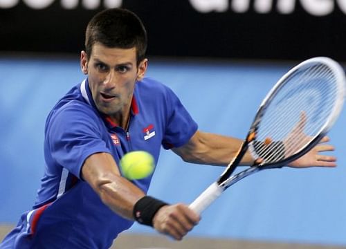 Novak Djokovic hits a return against Fernando Verdasco during a Hopman Cup match in Perth on January 5, 2013