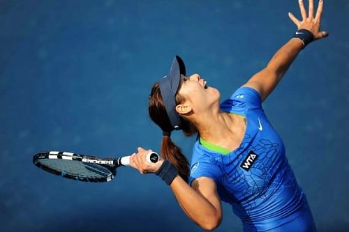 Li Na serves against Klara Zakopalova in a Shenzhen Open match on January 5, 2013