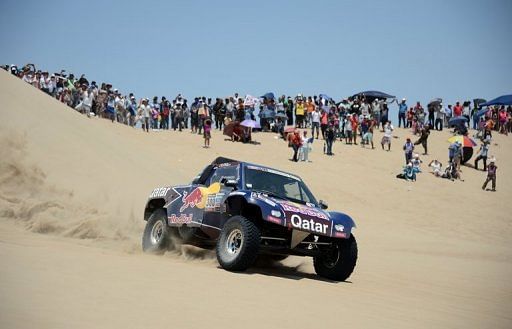 Carlos Sainz reaches the end of  Stage Two of the Dakar 2013 rally in Pisco, Peru, on January 6, 2013