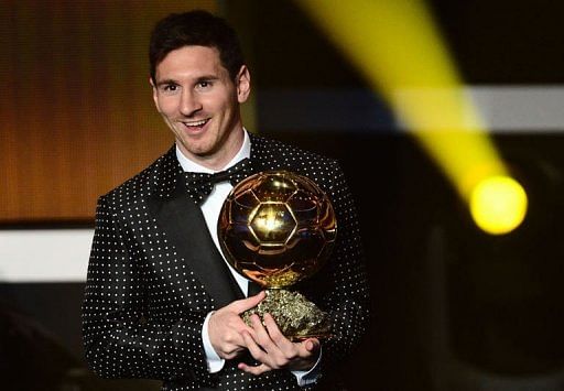 Lionel Messi holds the trophy during the FIFA Ballon d&#039;Or awards ceremony in Zurich on January 7, 2013