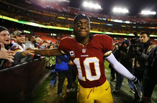 Robert Griffin III of the Washington Redskins greets fans after their game against Seattle on January 6, 2013